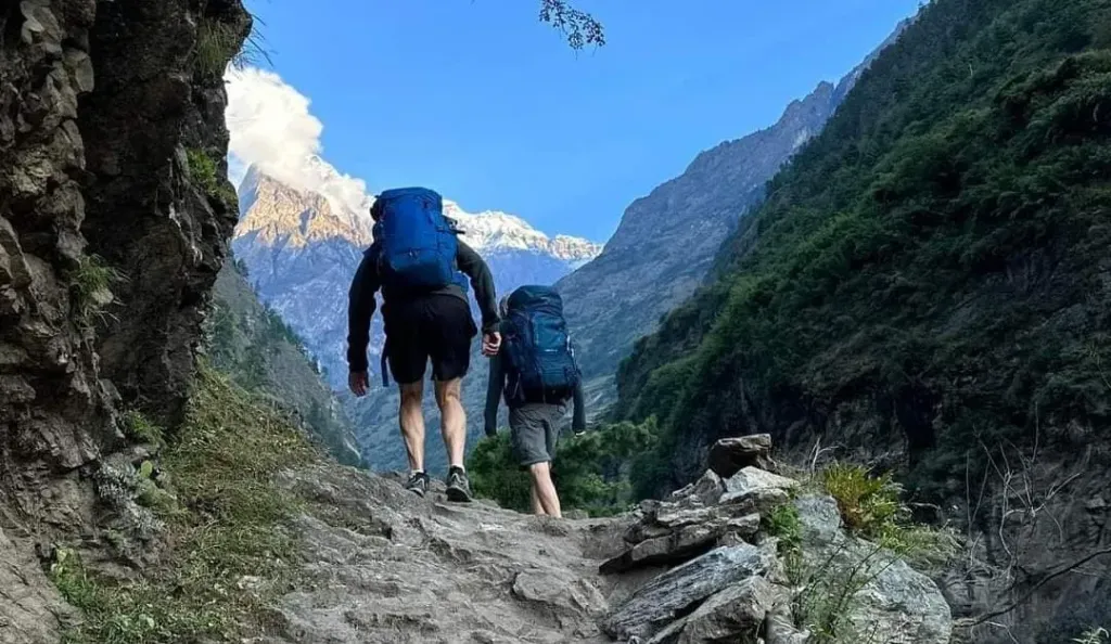 Trekkers trekking along the way to Dyang during manaslu circuit trek, organized by North Nepal Trek.
